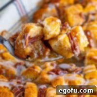 Gooey Pecan Pull-Apart Bake 10 A serving utensil holding some Pecan Pie Bubble Up.