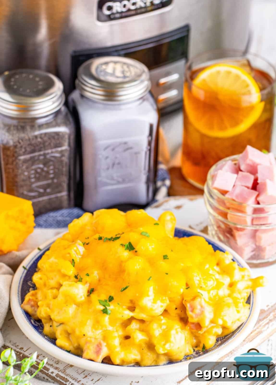 A small plate of creamy Ham Mac and Cheese, ready to be enjoyed.