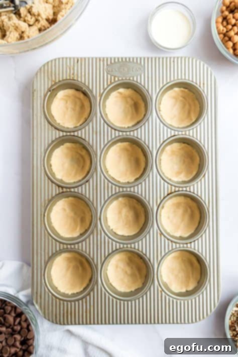 sugar cookie dough shown in muffin tin.