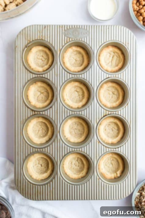 fully cooked sugar cookie dough in a muffin pan.