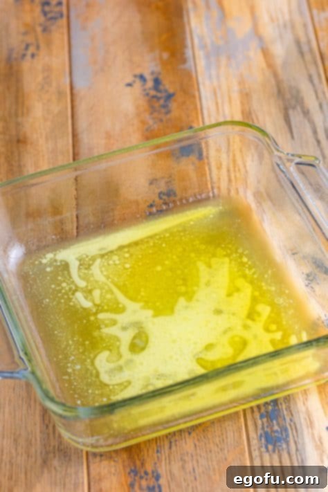 Melted butter in a baking dish.