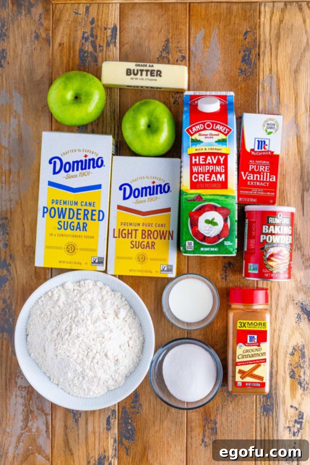 Apples, butter, light brown sugar, ground cinnamon, flour, sugar, aluminum free baking powder, heavy cream, vanilla extract, powdered sugar, and milk.