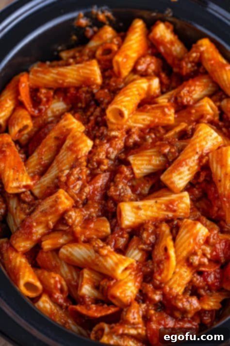 One-Pot Pizza Magic 12 The second half of the pasta mixture layered on top of the cheese.