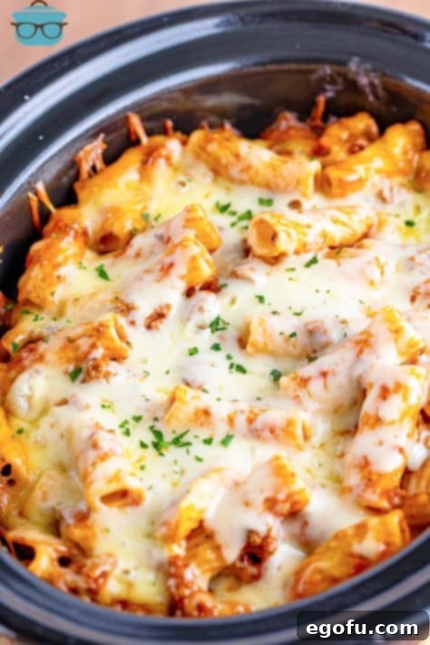 One-Pot Pizza Magic 14 Looking down on a crock pot filled with perfectly cooked Pizza Casserole.