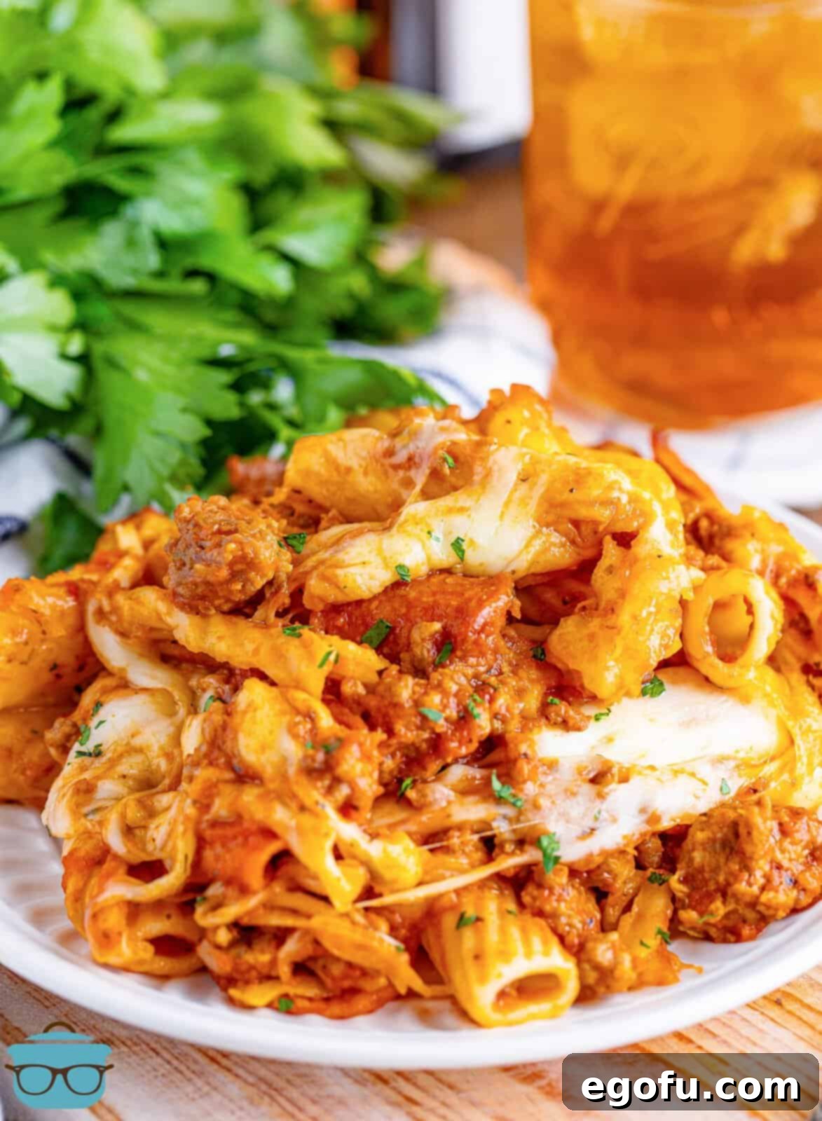 One-Pot Pizza Magic 15 A plate of delicious pizza casserole made in the Slow Cooker, garnished and ready to eat.