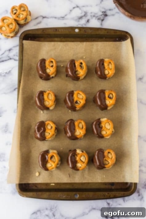 cookie dough pretzel bites dipped in melted chocolate.