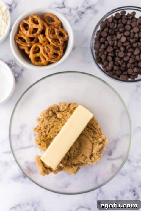 A mixing bowl with sugars and butter.