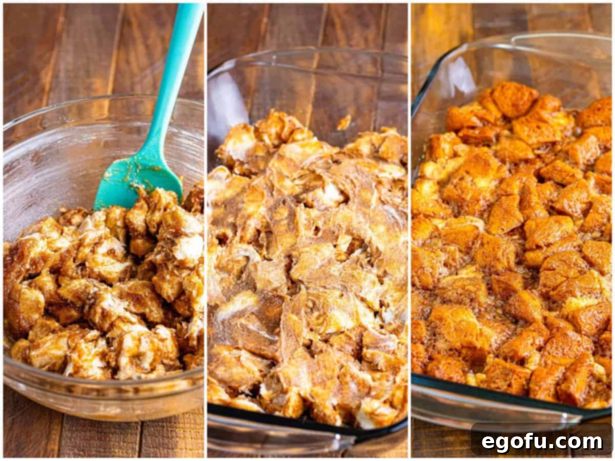 The folded cinnamon roll mixture, with biscuit pieces and cream cheese coated in sauce, shown in a mixing bowl.
