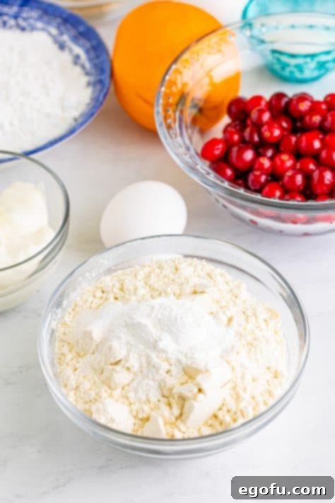 A mixing bowl of flour, baking powder, and salt.
