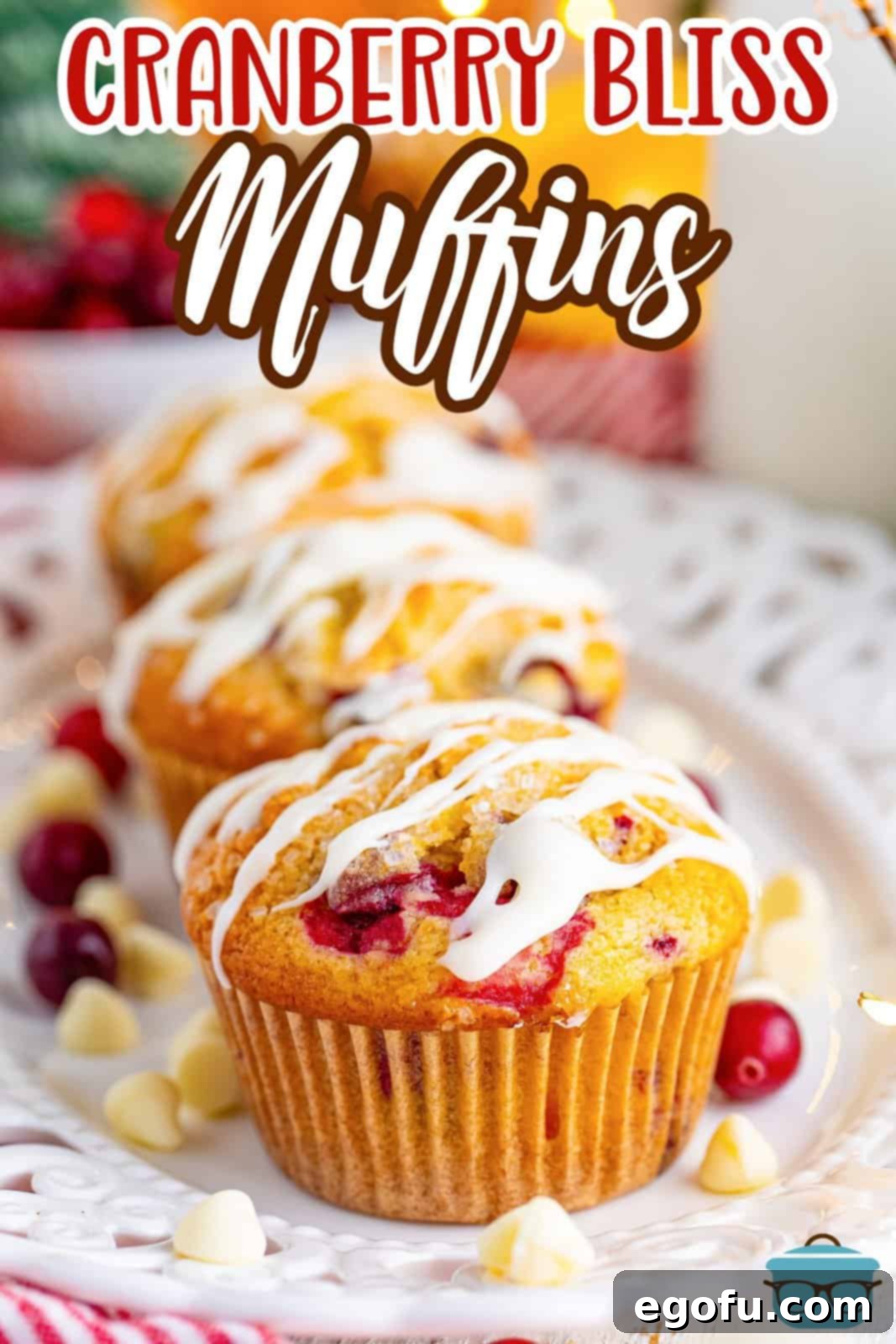 A line of a few homemade Cranberry Bliss Muffins on a plate.