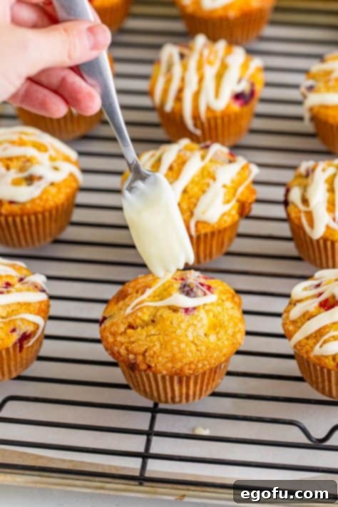 drizzling cream cheese glaze on top of muffins.