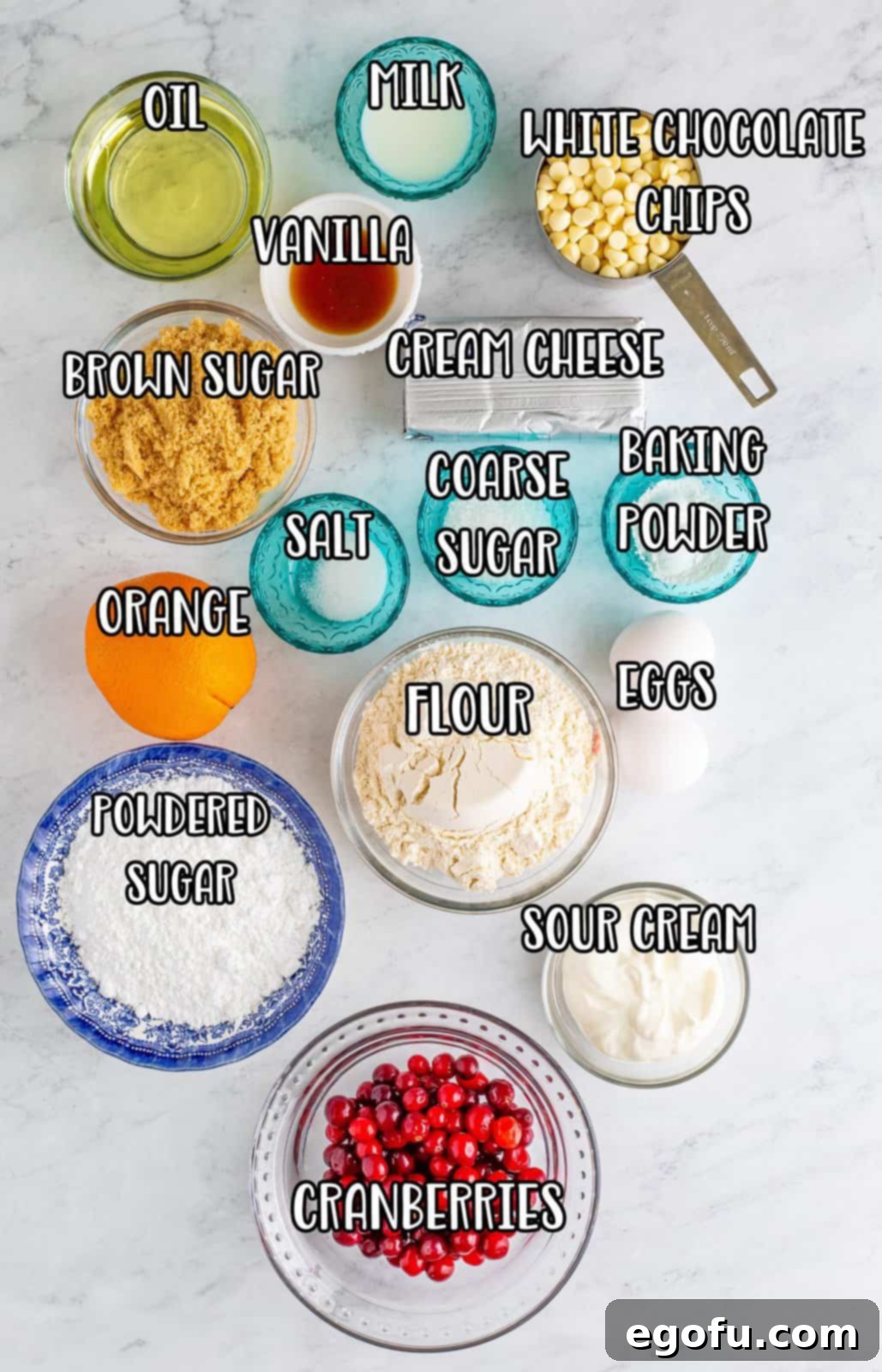 Flour, baking powder, salt, vegetable oil, brown sugar, eggs, sour cream, orange zest, orange juice, milk, vanilla extract, cranberries, chocolate chips, and sugar.