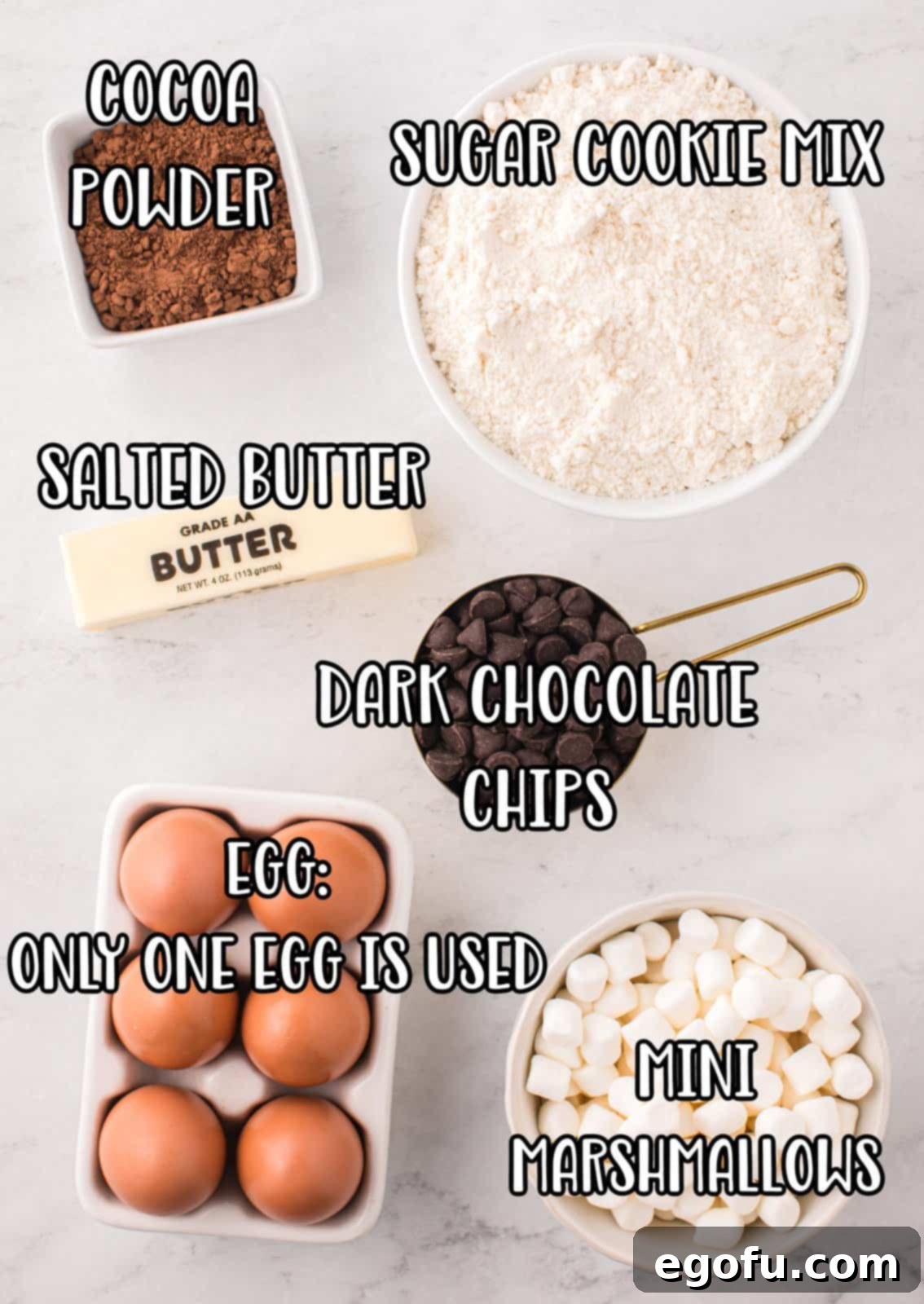 Cocoa powder, eggs, mini marshmallows, butter, dark chocolate chips and sugar cookie mix. 