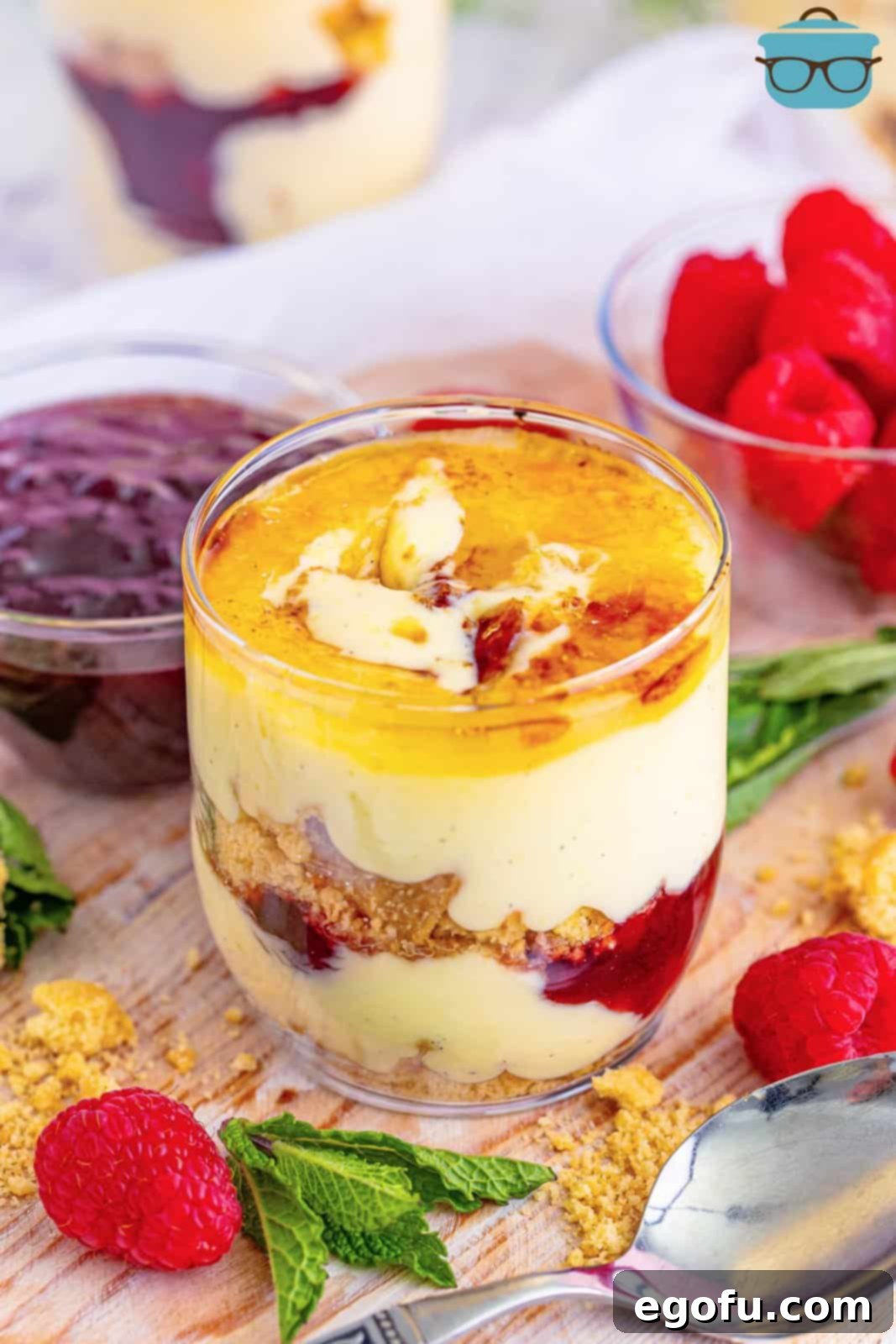 Creme Brûlée Parfaits 2 A beautiful glass of creme brulee, raspberry jam and shortbread cookies layered to make a Creme Brulee Trifle.