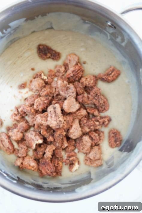 Candied pecans on creamy fudge mixture.