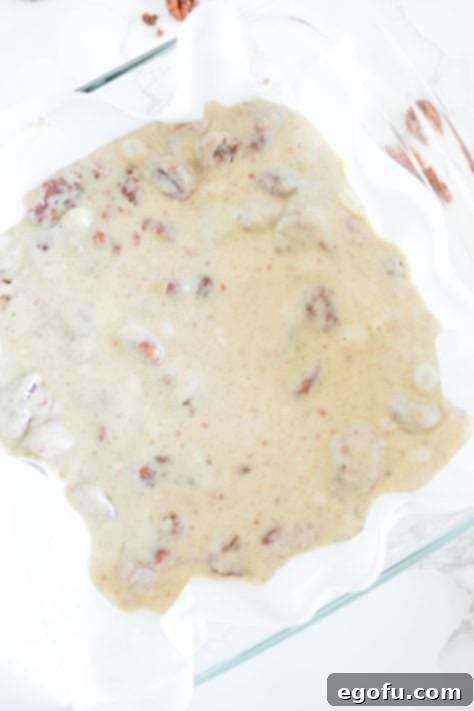 Unset fudge in a parchment lined baking dish.