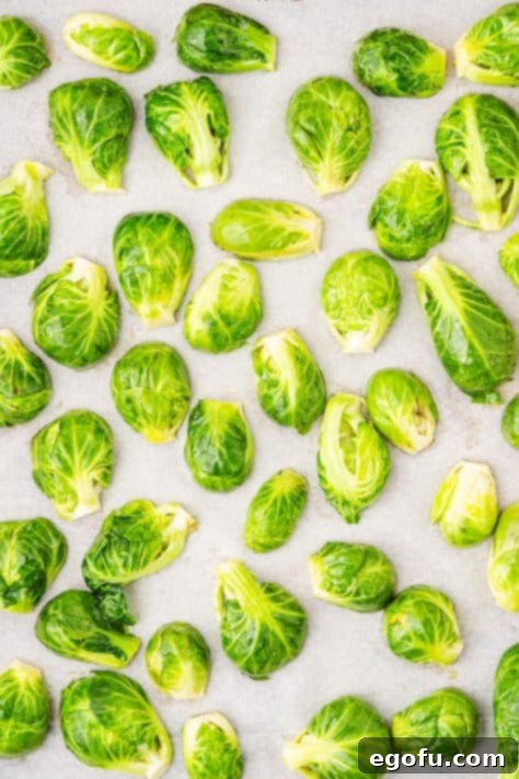Crispy Holiday Brussels Sprouts 12 A baking sheet with brussels sprouts.