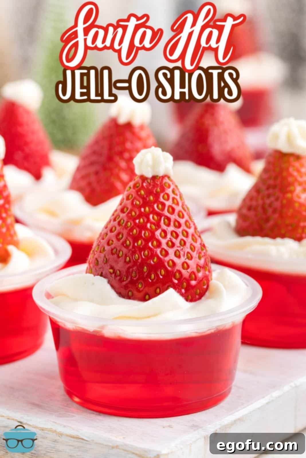 Spirited Santa Hat Shooters 3 A few Santa Hat jello shots with strawberries and whipped cream.