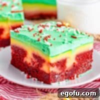 A piece of Christmas Poke Cake on a plate.