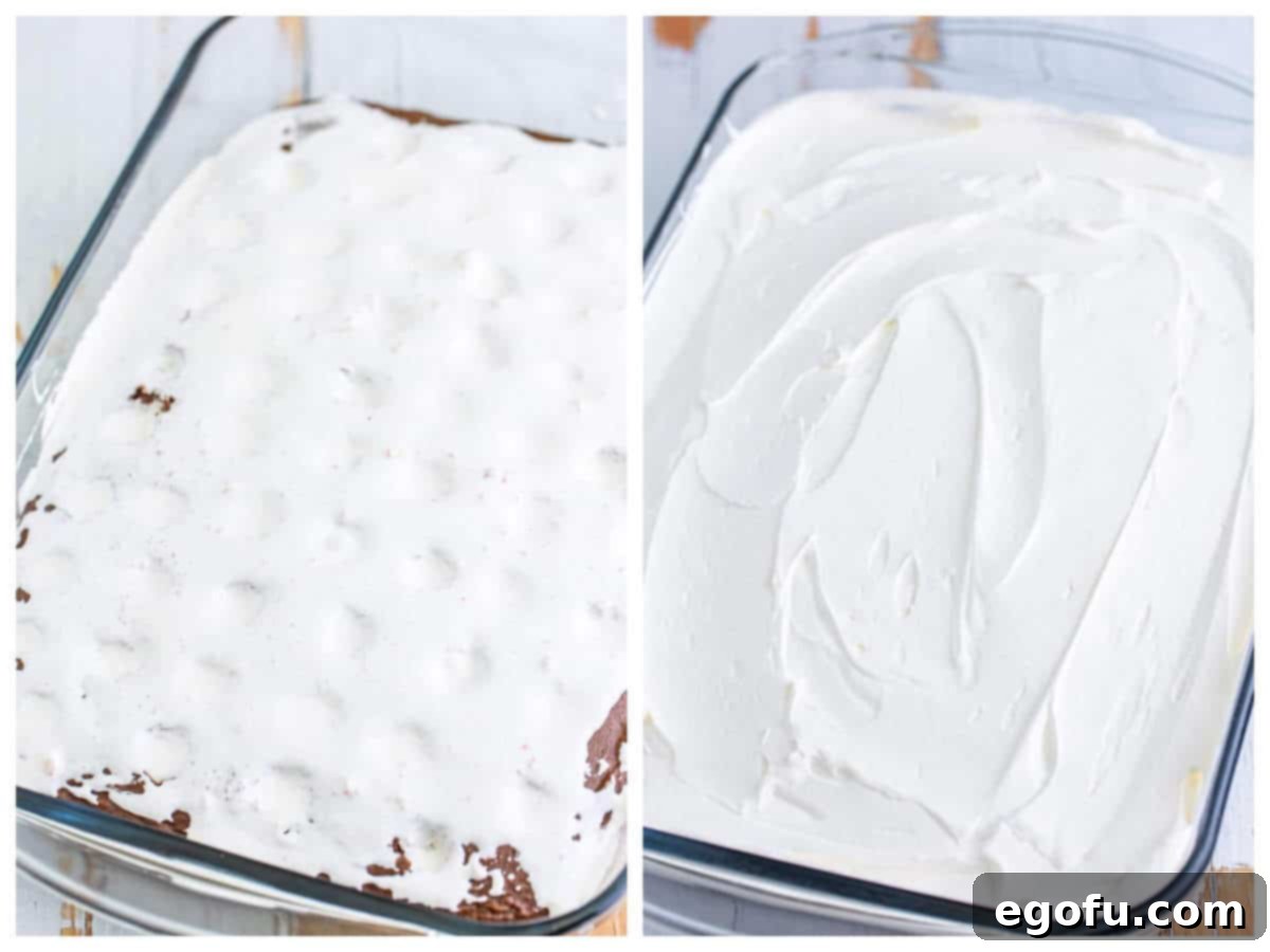 A collage of two photos: on the left, the marshmallow fluff mixture spread on top of the cake and into the poked holes; on the right, whipped topping is spread smoothly over the marshmallow layer on the cake.
