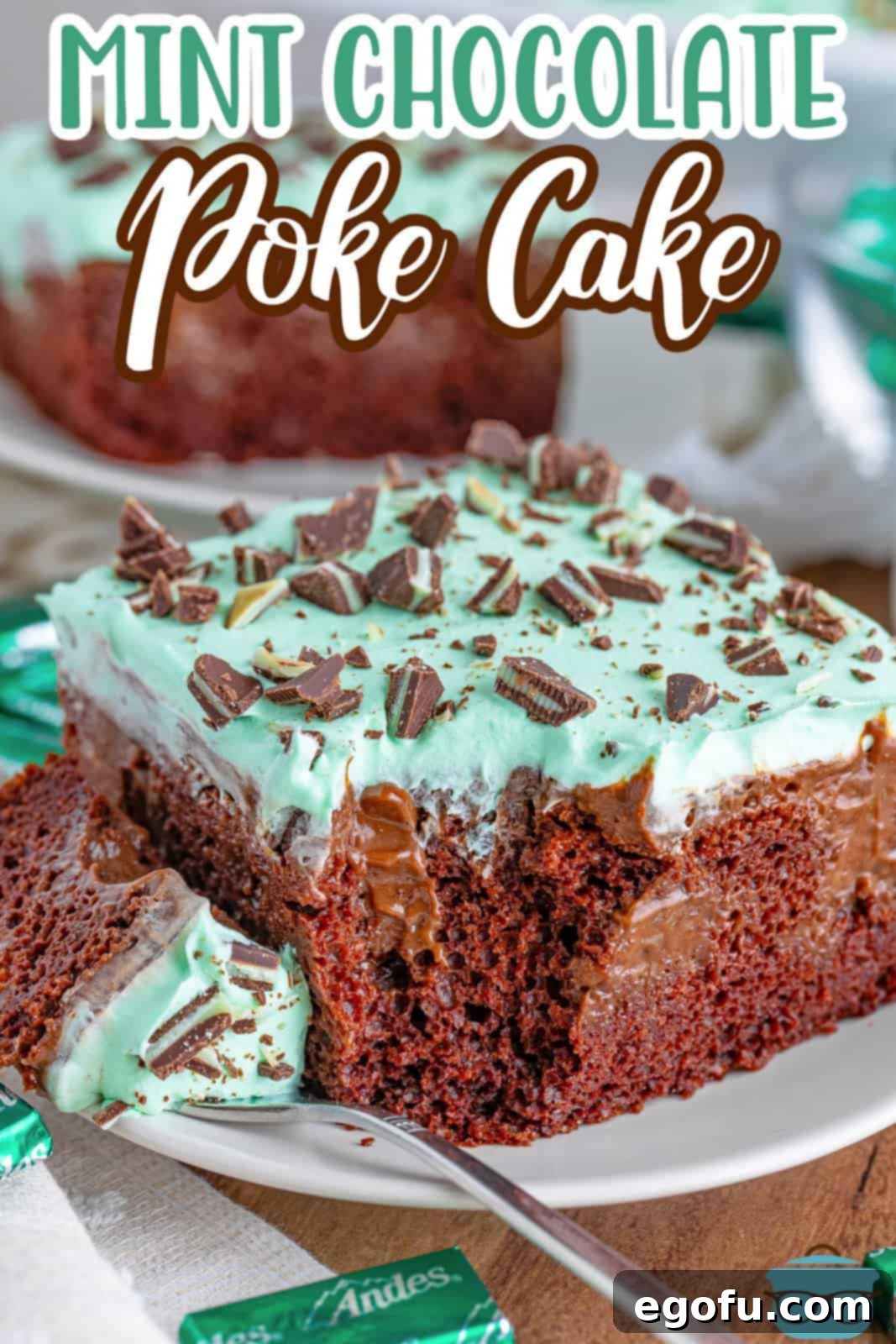 Peppermint Patty Poke Cake 8 A delectable slice of Mint Chocolate Poke Cake, complete with a fork ready to take a bite, presented on a white plate.