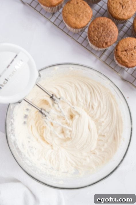 Cozy Gingerbread Cupcakes 13 Cream cheese frosting in a bowl.