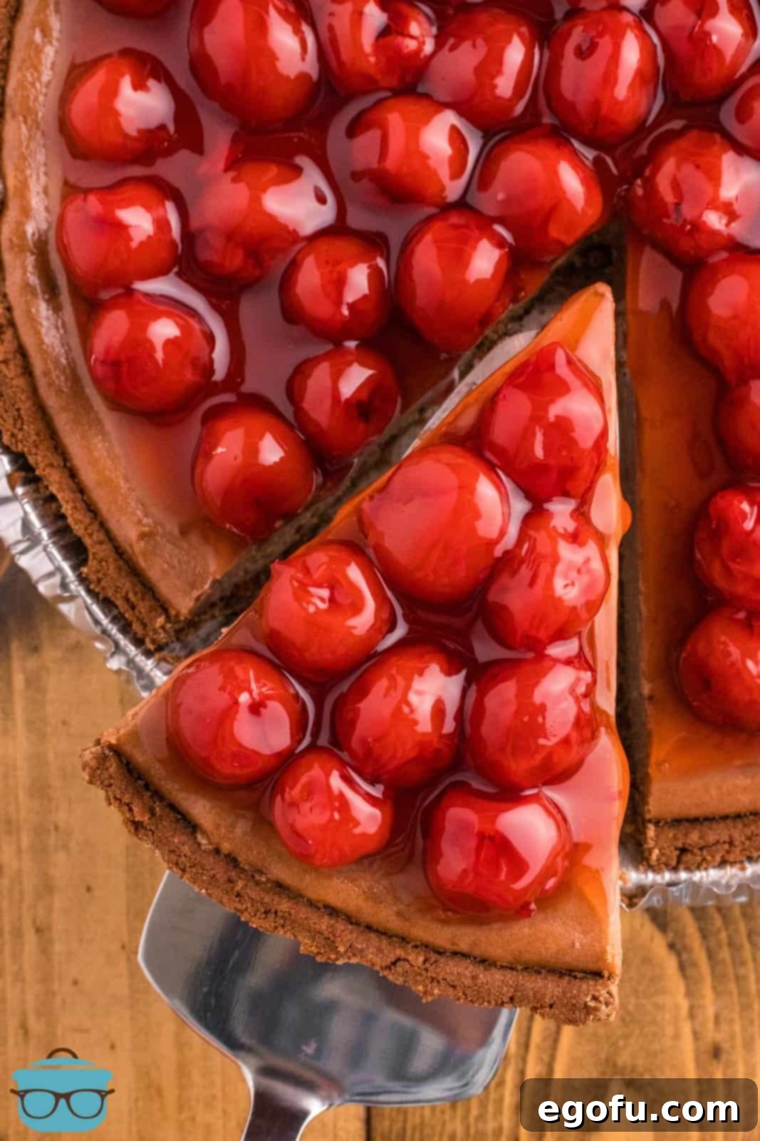 Decadent Cherry Chocolate Cheesecake 9 A close-up view of a slice of Cherry Chocolate cheesecake, ready to be enjoyed.