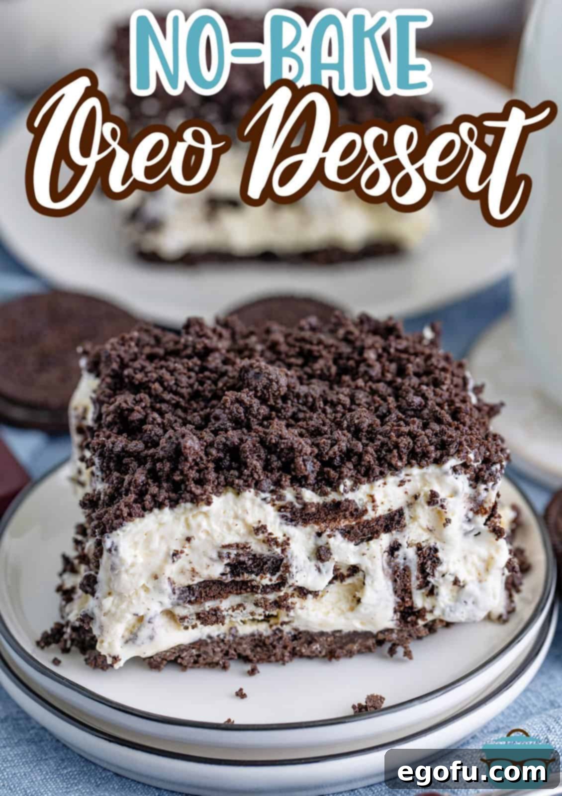 A few plates in a pile with a piece of No Bake Oreo Dessert on the top plate.