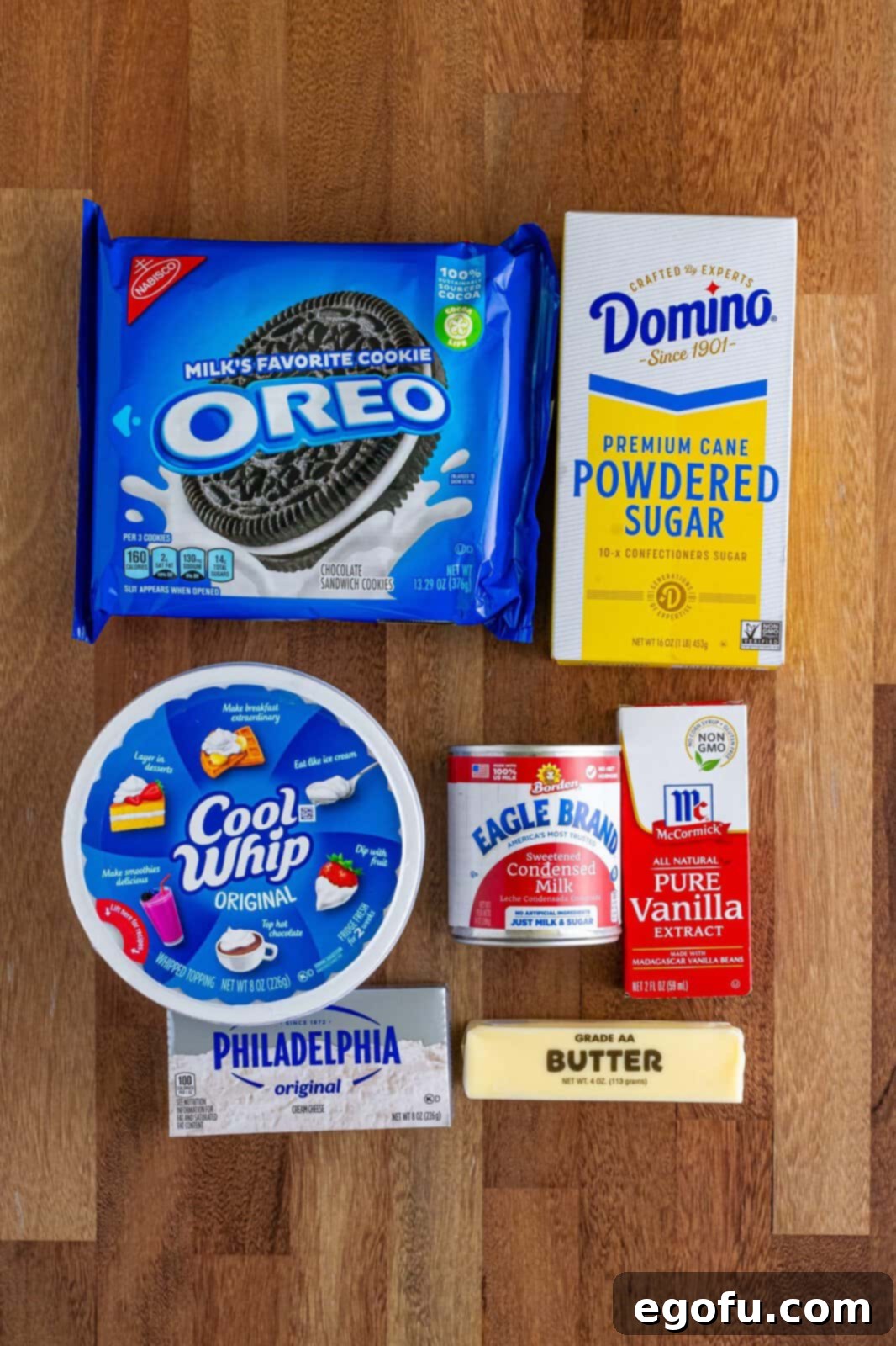 Oreo cookies, butter, powdered sugar, Cool Whip, vanilla extract, cream cheese, and sweetened condensed milk.