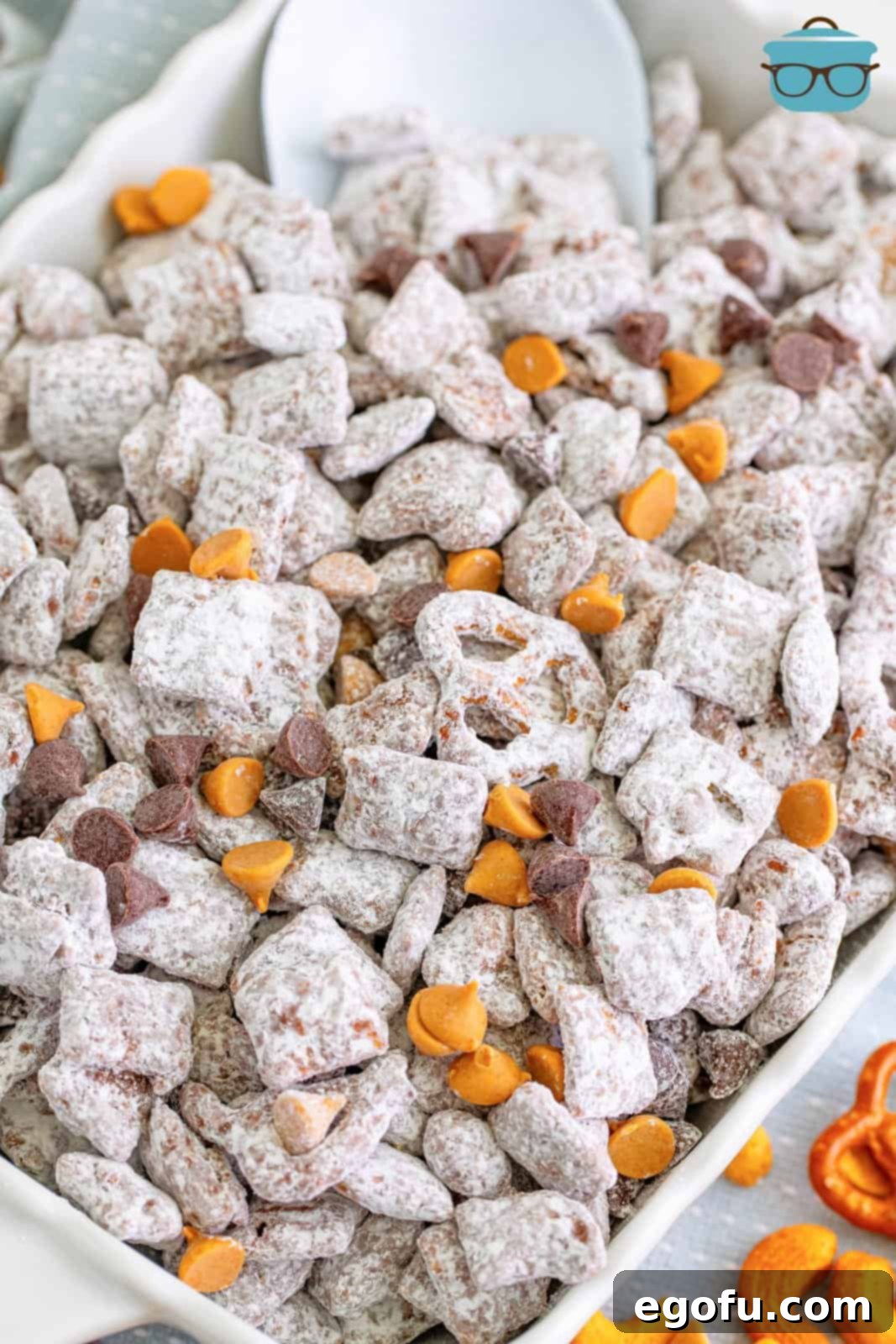 A baking dish with Chex Mix Muddy Buddies.