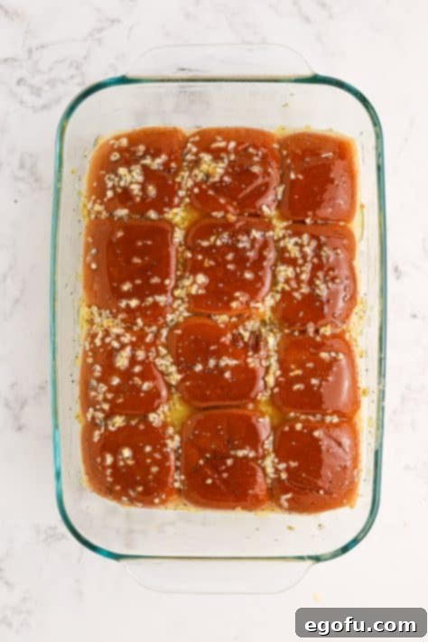 Herbed butter on top of Hawaiian Roll sandwiches.