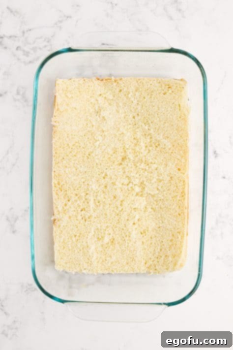 The bottom halves of all the Hawaiian Rolls in a baking dish.