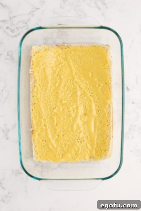 A mixture of mayonnaise, honey and mustard spread on the Hawaiian Rolls.