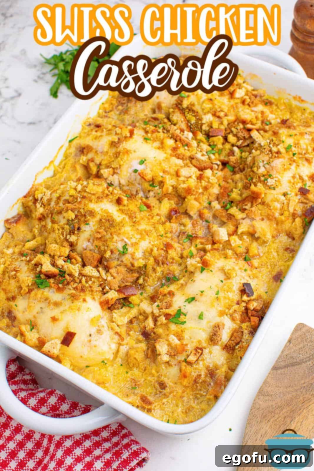 A large baking dish filled with the golden-brown, bubbly Swiss Chicken Casserole, ready for serving.