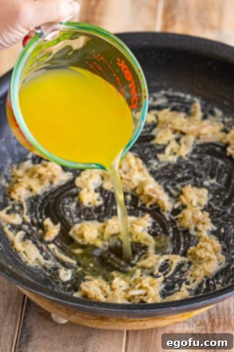 Chicken stock added to shallot mixture.