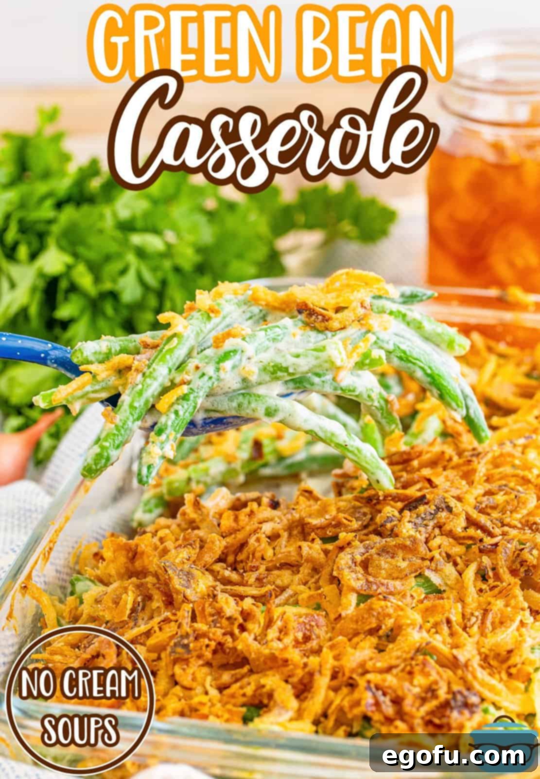 A serving utensil holding a scoop of Green Bean Casserole with no cream soups.