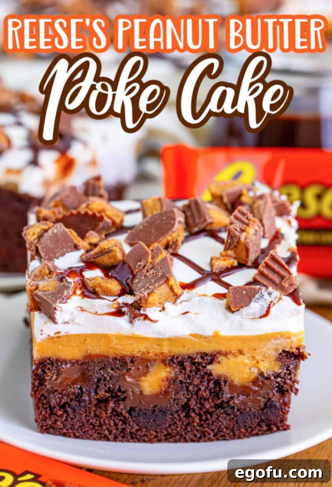 A garnished piece of Peanut Butter Reese's Poke Cake.
