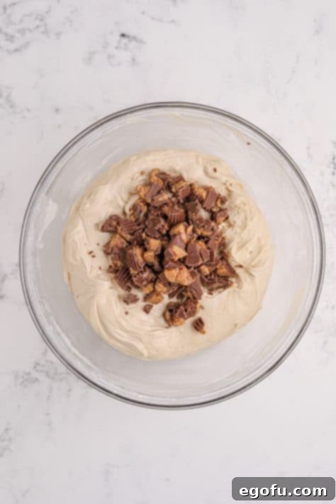 Reese's Peanut Butter Cheesecake Minis 13 Reese's cups on top of the cheesecake mixture.