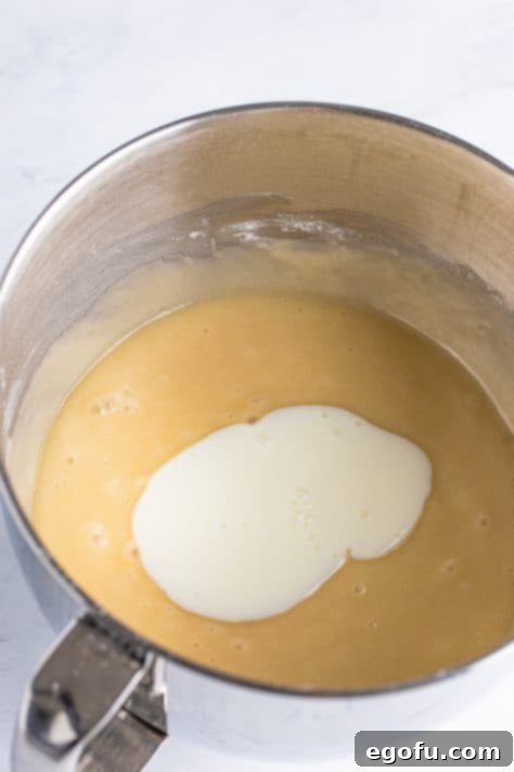 Bridal Bliss Bites 14 Buttermilk being added to cake batter.