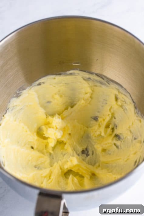 Bridal Bliss Bites 17 Butter being whipped in the bowl of a stand mixer.