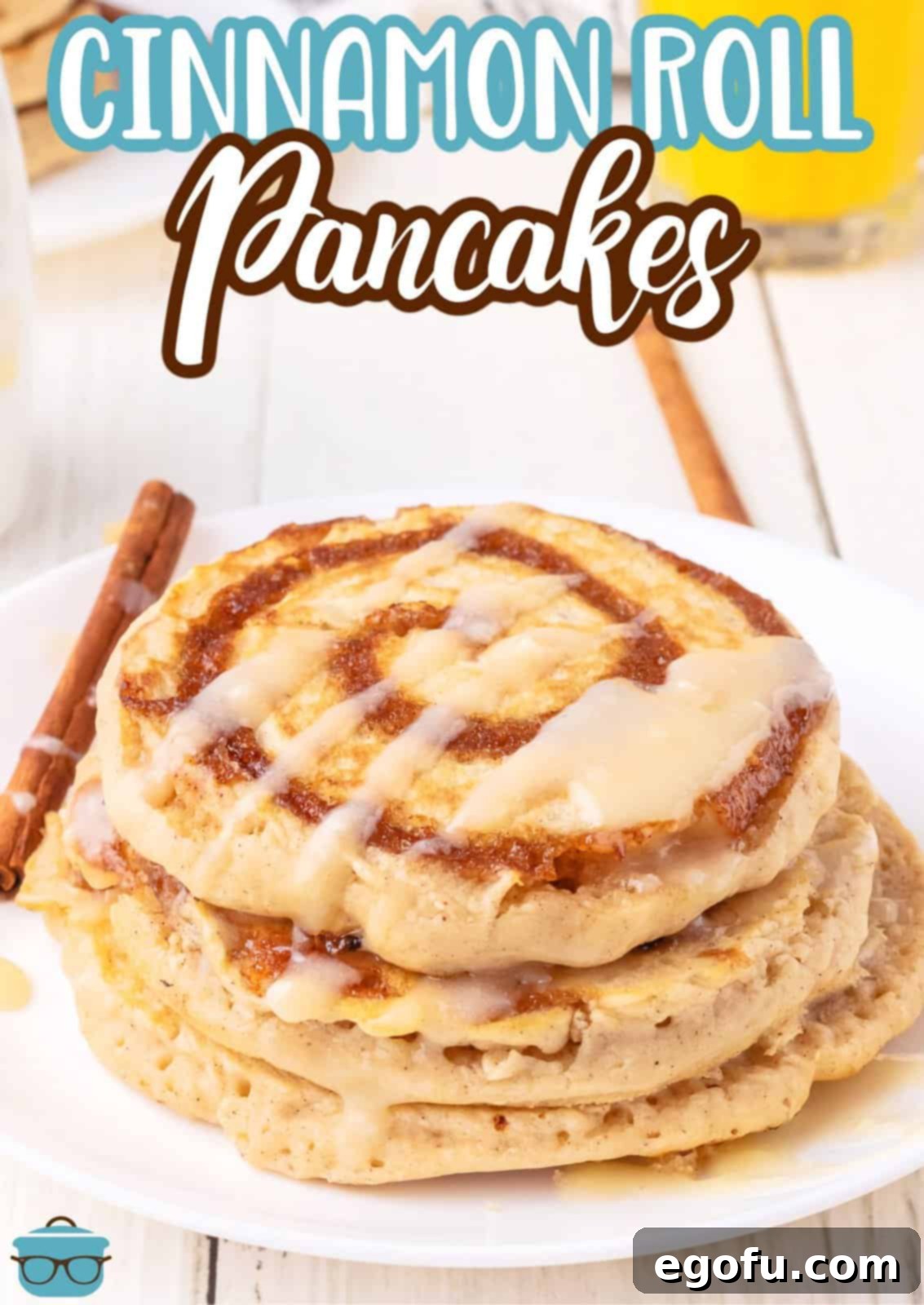 A plate of golden brown Cinnamon Roll Pancakes artfully arranged on a rustic counter, highlighting their appealing texture.