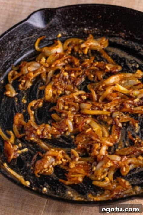 Flour, onions, and garlic in a skillet.