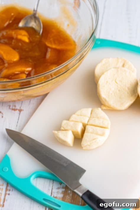 a knife cutting a biscuit into 8 pieces.