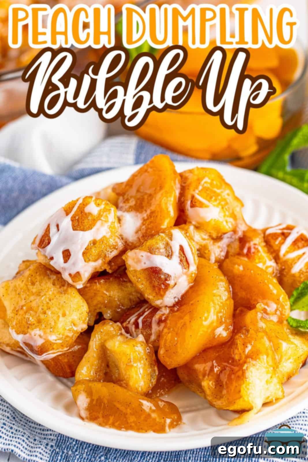 Looking down on a plate of Peach Bubble Up, showing its golden-brown top and sweet glaze.