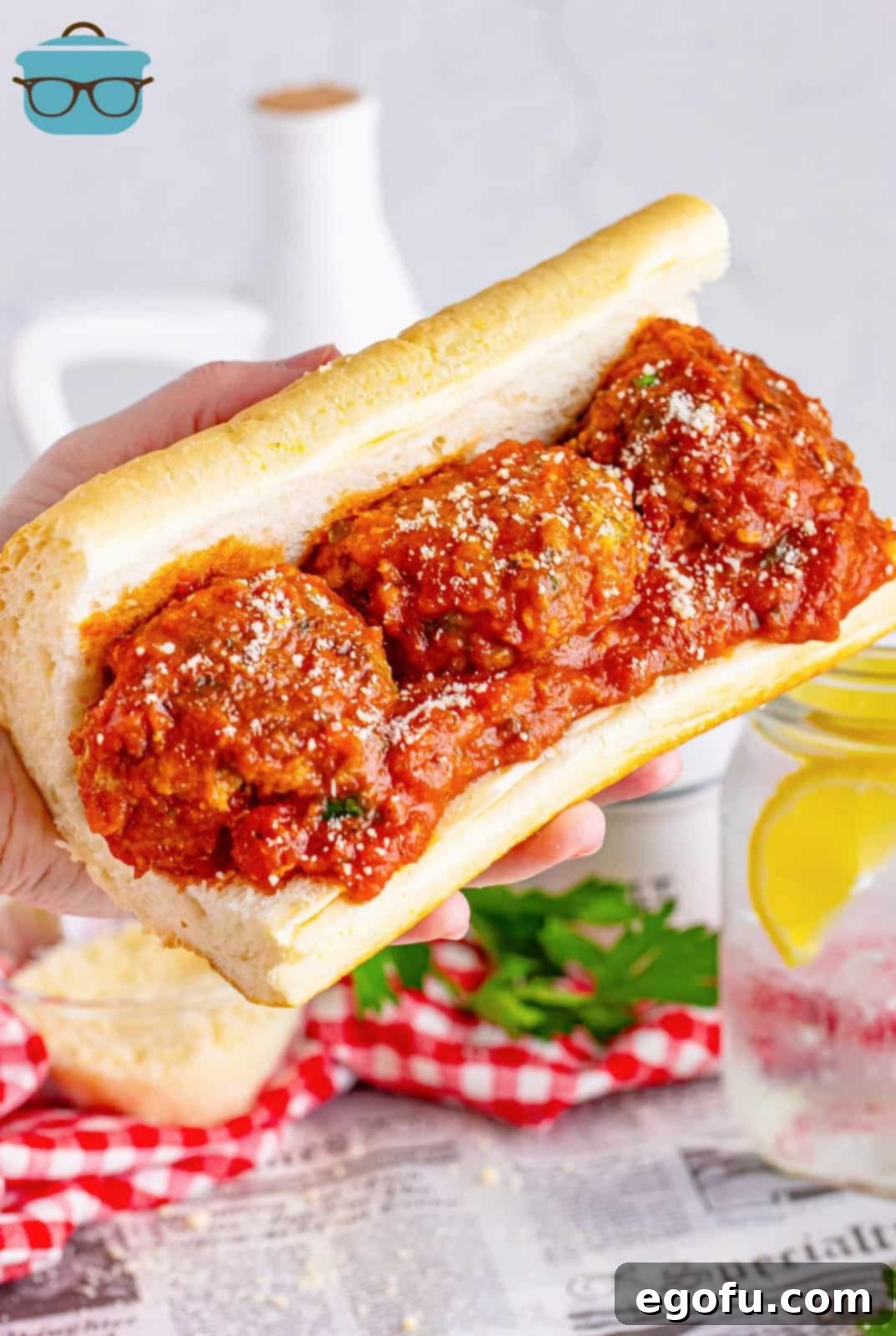 Hand-Rolled Meatballs 10 A large sub roll brimming with golden-brown homemade meatballs, topped with sauce, ready for cheese.