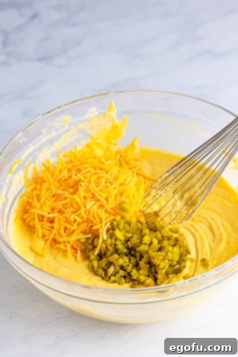 Cheddar cheese and pickled jalapenos in corn dog batter.