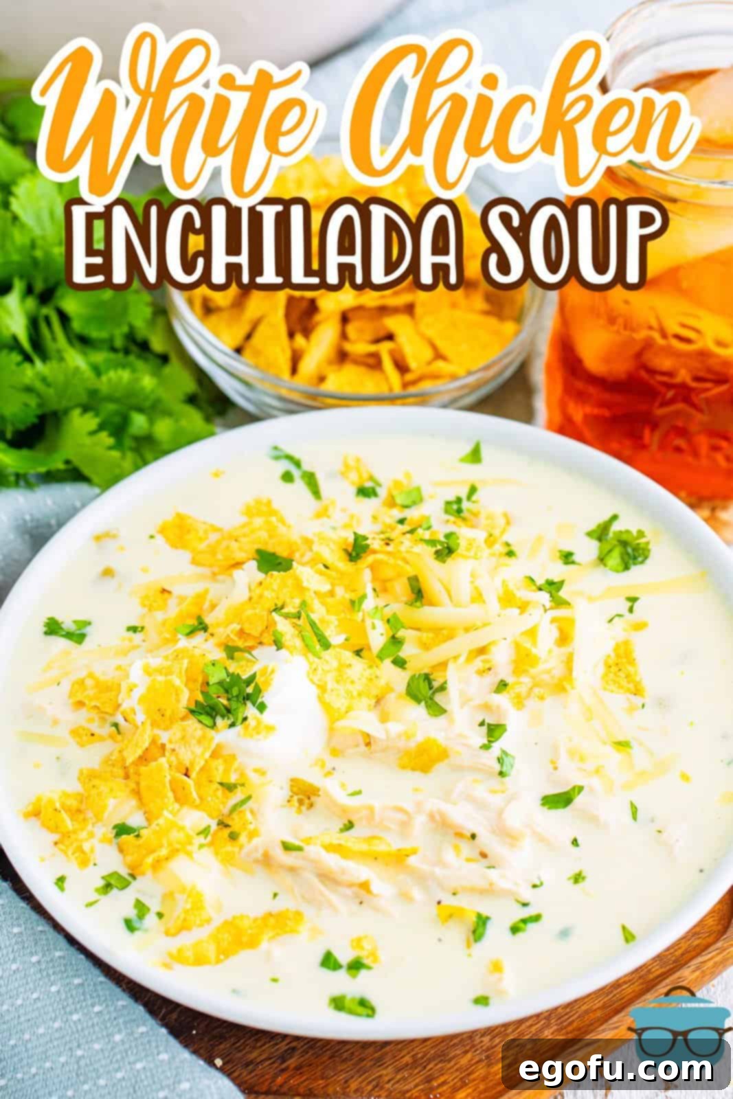 A large Dutch oven with White Chicken Enchilada Soup, ready to be served.