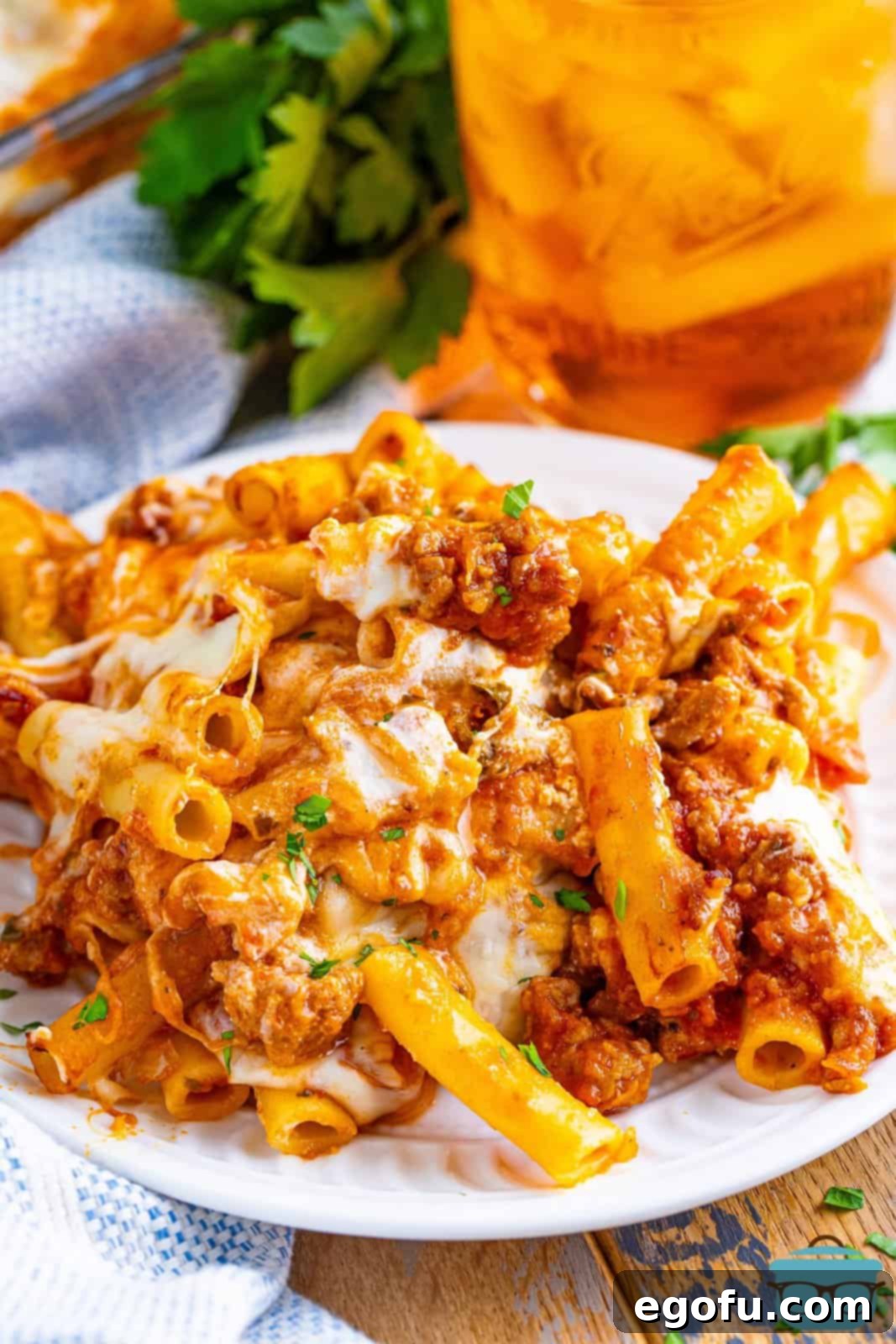 A serving of Baked Ziti for Two on a plate, garnished with fresh parsley.