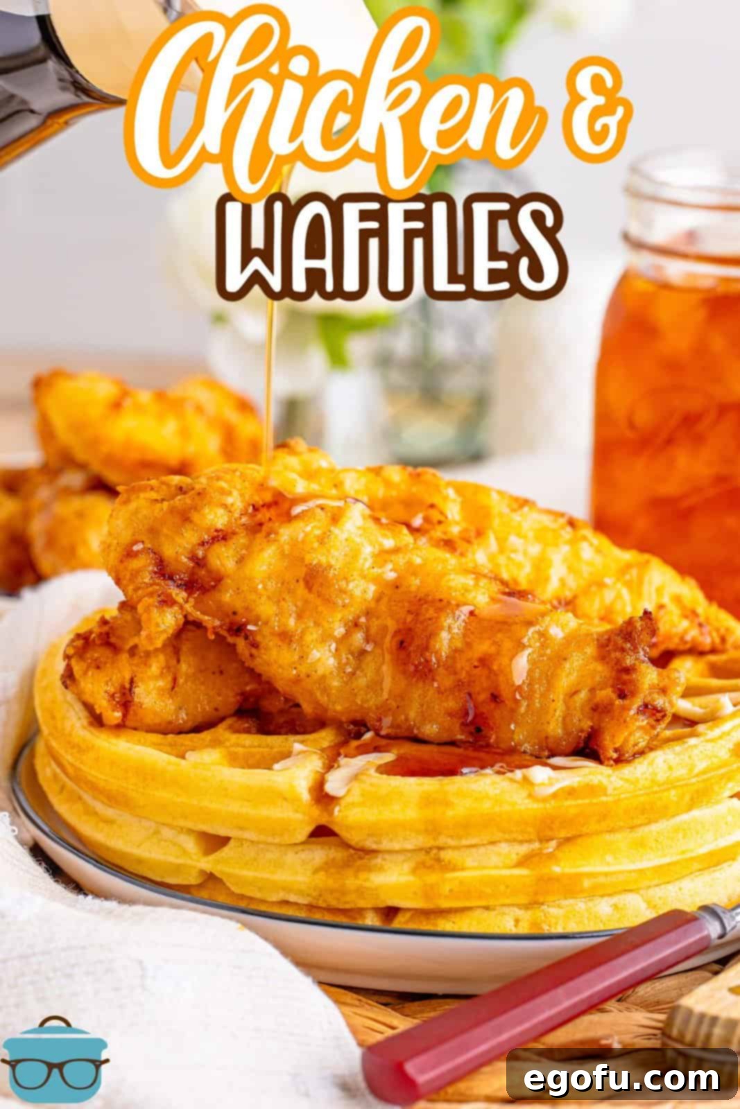 A plate with thick Buttermilk Waffles and Chicken.
