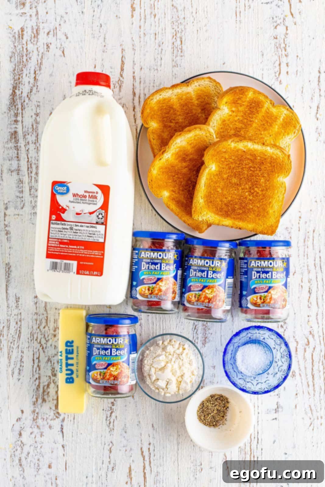 Toast, whole milk, chopped beef, unsalted butter, salt, pepper, and flour.